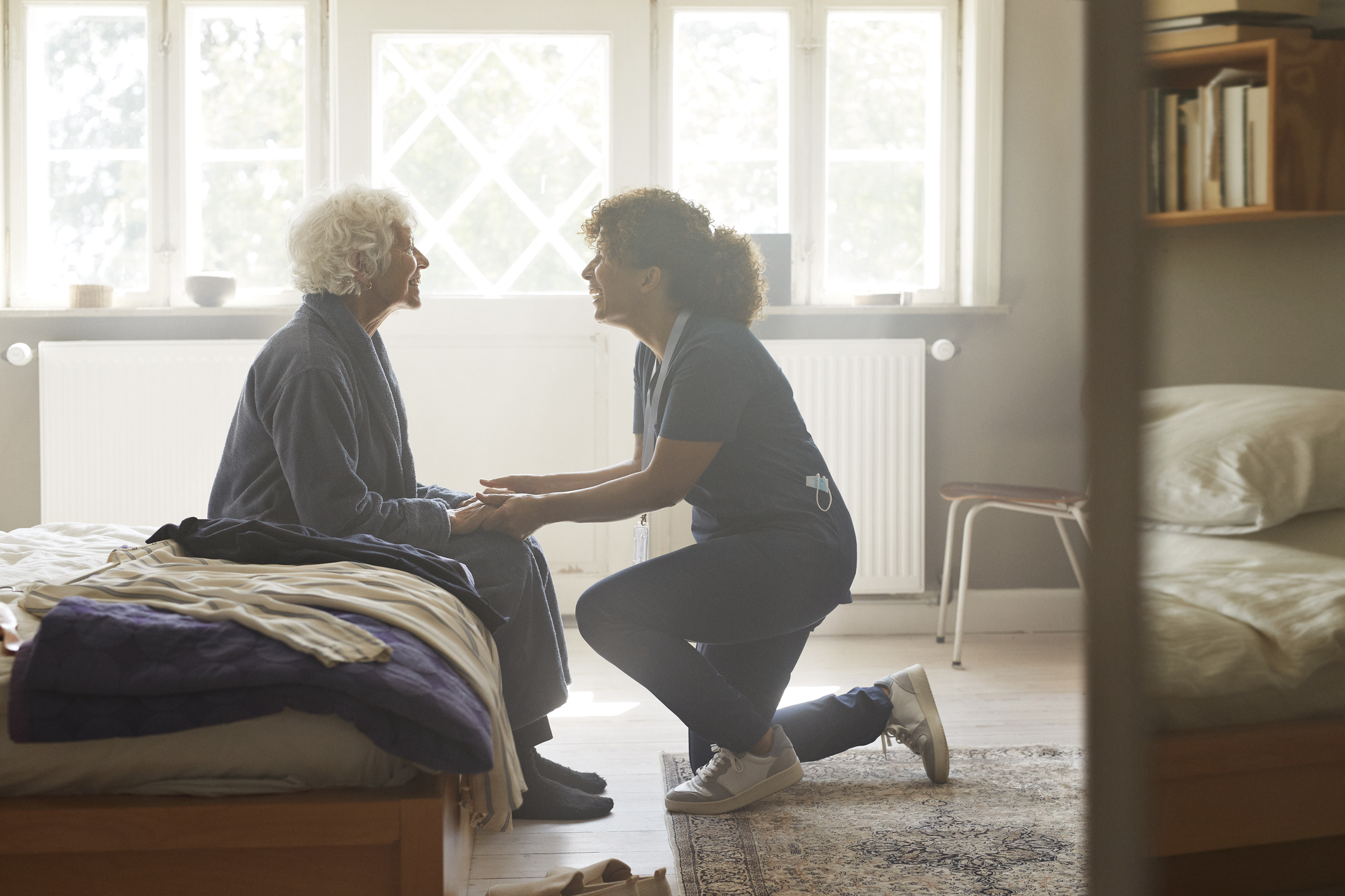 Banner Eldercare Caregiver Caregiver holding hands of senior woman