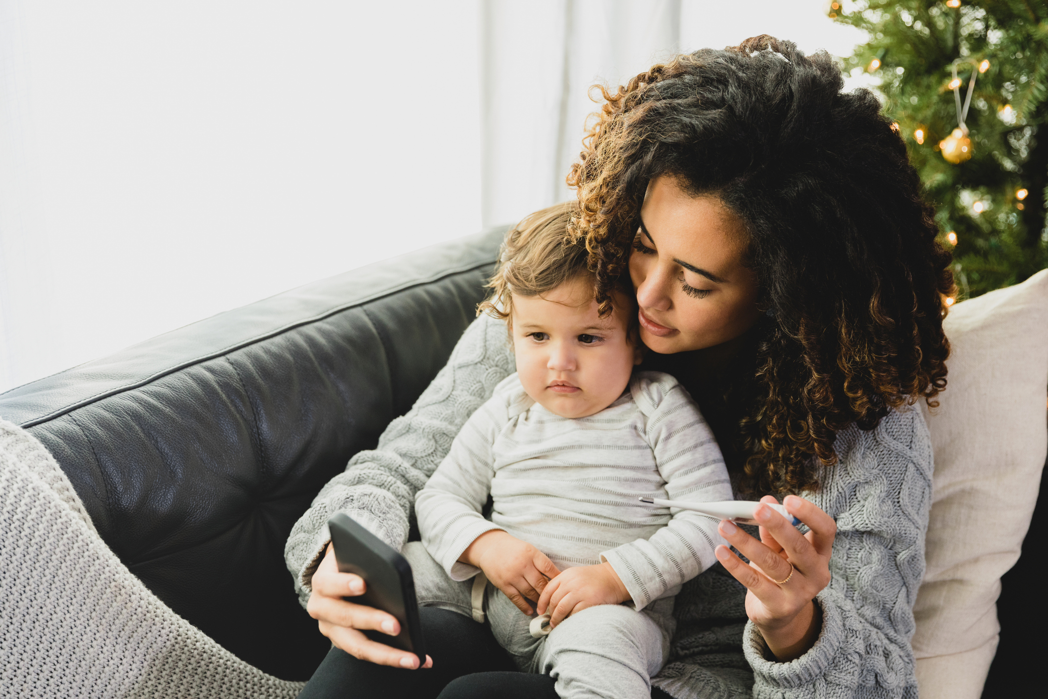 Banner Virtual care telehealth Worried mom talks with son's doctor during telemedicine visit